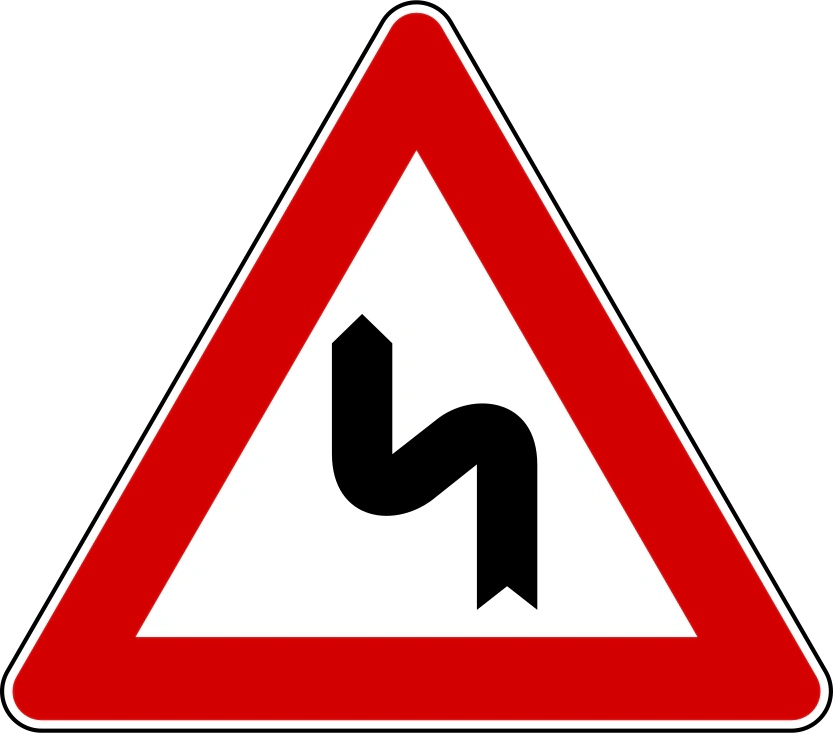 IT-W-07 - Double bend, first to left road sign